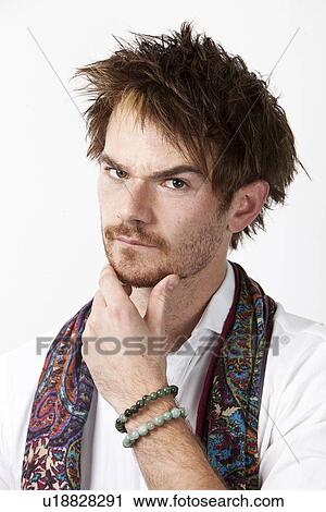 Close-up of young contemplating man against white background View Large Photo Image Stock Image - Close-up of young contemplating man against white background. Fotosearch