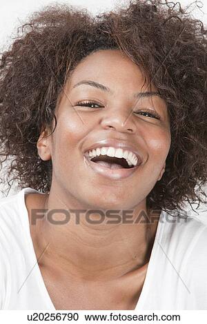 Close-up portrait of joyful African American young woman laughing View Large Photo Image Stock Image - Close-up portrait of joyful African American young woman laughing. Fotosearch