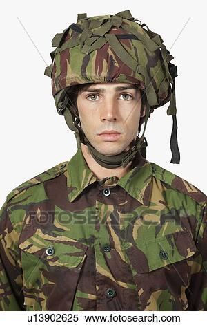 Close-up portrait of soldier against gray background View Large Photo Image Stock Photography - Close-up portrait of soldier against gray background. Fotosearch