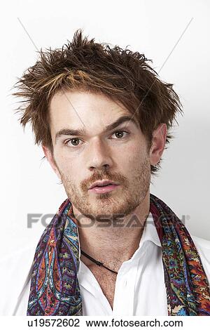 Close-up portrait of suspicious man against white background View Large Photo Image Stock Image - Close-up portrait of suspicious man against white background. Fotosearch