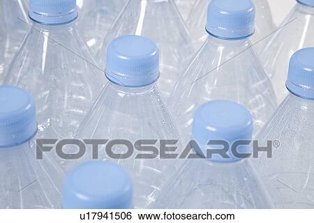 Close-up view of empty plastic bottles with blue caps View Large Photo Image Stock Photograph - Close-up view of empty plastic bottles with blue caps. Fotosearch
