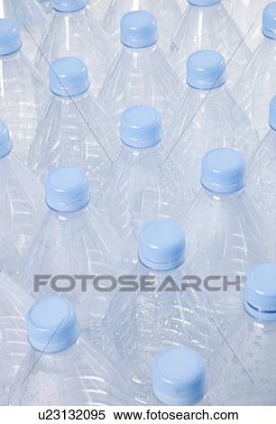 Close-up view of empty plastic bottles with blue caps View Large Photo Image Stock Photography - Close-up view of empty plastic bottles with blue caps. Fotosearch