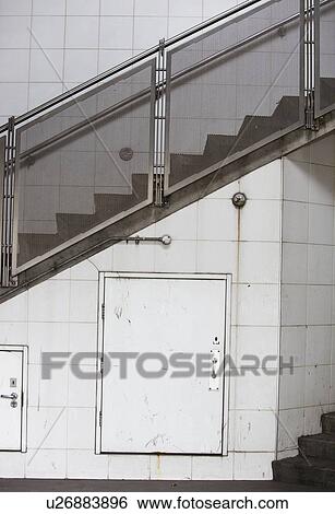 Closed door on wall and stairway View Large Photo Image Stock Photograph - Closed door on wall and stairway. Fotosearch