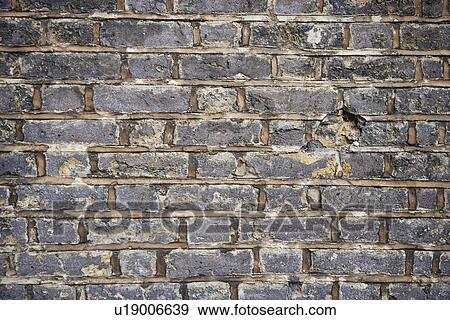 Full frame shot of decayed brick wall View Large Photo Image Stock Photo - Full frame shot of decayed brick wall. Fotosearch