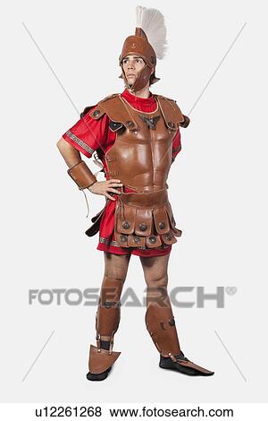 Full length of an old fashioned soldier against gray background View Large Photo Image Stock Photo - Full length of an old fashioned soldier against gray background. Fotosearch
