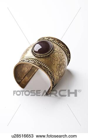 Gem on metal bracelet over white background View Large Photo Image Stock Image - Gem on metal bracelet over white background. Fotosearch