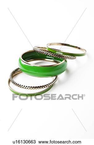 Green bangles over white background View Large Photo Image Stock Image - Green bangles over white background. Fotosearch