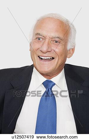 Stock Photo - Happy elderly businessman against white background. Fotosearch