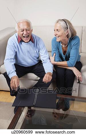 Happy senior woman looking at spouse laughing View Large Photo Image Stock Photo - Happy senior woman looking at spouse laughing. Fotosearch