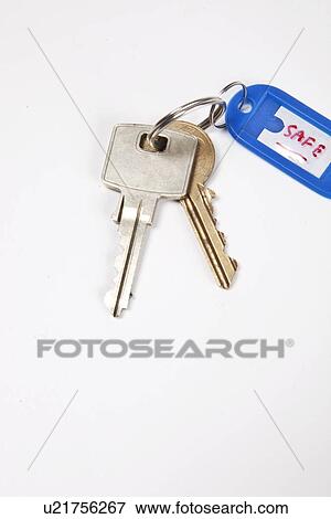 Keys with key ring tag on white background View Large Photo Image Stock Photo - Keys with key ring tag on white background. Fotosearch