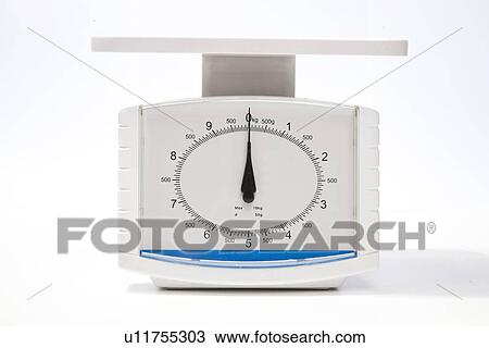 Kitchen weighing scale over white background View Large Photo Image Stock Image - Kitchen weighing scale over white background. Fotosearch