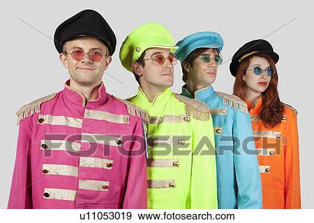 Marching band members in colorful clothing against gray background View Large Photo Image Stock Photo - Marching band members in colorful clothing against gray background. Fotosearch