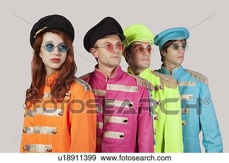 Marching band members in colorful clothing against gray background View Large Photo Image Stock Photo - Marching band members in colorful clothing against gray background. Fotosearch