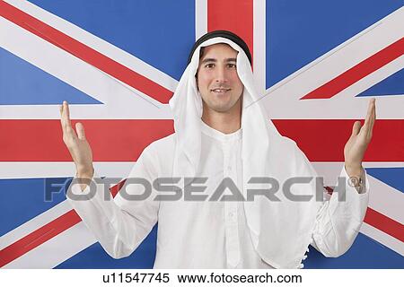 Portrait of an Arab man in traditional clothes against American flag View Large Photo Image Stock Photography - Portrait of an Arab man in traditional clothes against American flag. Fotosearch