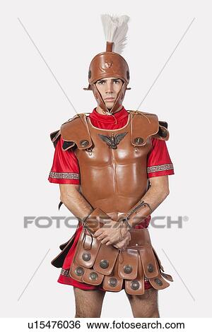 Portrait of an old fashioned soldier against gray background View Large Photo Image Stock Photograph - Portrait of an old fashioned soldier against gray background. Fotosearch
