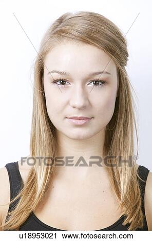 Stock Image - Portrait of beautiful young woman against white background. Fotosearch