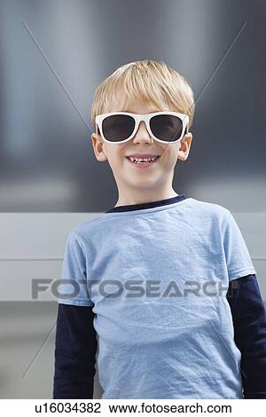 Portrait of Caucasian boy in casuals wearing sunglasses View Large Photo Image Stock Image - Portrait of Caucasian boy in casuals wearing sunglasses. Fotosearch