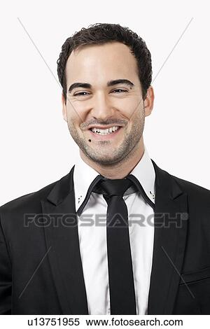 Portrait of cheerful young businessman against white background View Large Photo Image Stock Photography - Portrait of cheerful young businessman against white background. Fotosearch