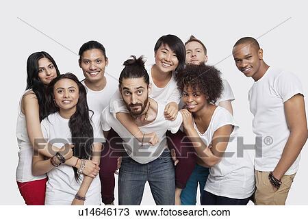 Portrait of cheerful young multi-ethnic friends against white background View Large Photo Image Stock Image - Portrait of cheerful young multi-ethnic friends against white background. Fotosearch