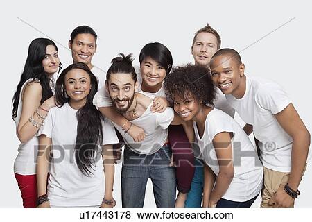 Portrait of cheerful young multi-ethnic friends against white background View Large Photo Image Stock Photo - Portrait of cheerful young multi-ethnic friends against white background. Fotosearch
