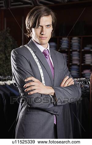 Portrait of confident owner with arms crossed standing in store View Large Photo Image Stock Photo - Portrait of confident owner with arms crossed standing in store. Fotosearch