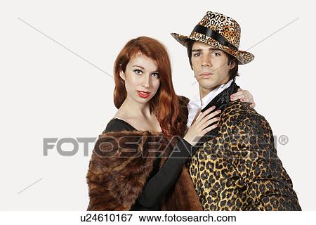 Portrait of couple in fur costume over gray background View Large Photo Image Stock Photo - Portrait of couple in fur costume over gray background. Fotosearch