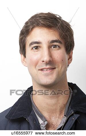 Portrait of handsome Middle Eastern young man smiling against white background View Large Photo Image Stock Photo - Portrait of handsome Middle Eastern young man smiling against white background. Fotosearch