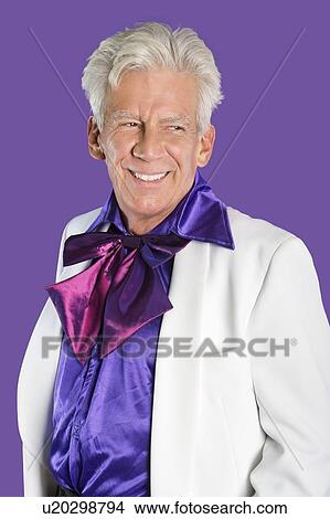 Portrait of happy senior man wearing old-fashioned suit against purple background View Large Photo Image Picture - Portrait of happy senior man wearing old-fashioned suit against purple background. Fotosearch