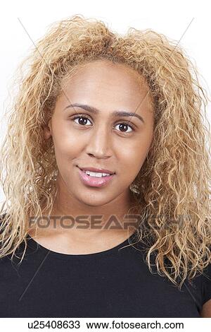 Portrait Of Happy Young Mixed Race Woman With Blond Curly Hair