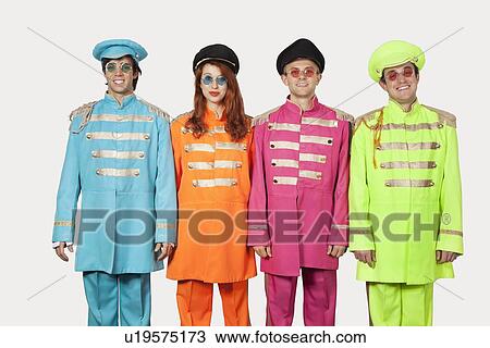 Portrait of marching band members in colorful clothing against gray background View Large Photo Image Stock Image - Portrait of marching band members in colorful clothing against gray background. Fotosearch
