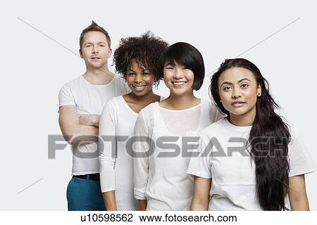 Stock Image - Portrait of multi-ethnic friends in casuals smiling together over white background. Fotosearch