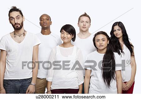 Stock Image - Portrait of multi-ethnic friends in white t-shirts standing together over white background. Fotosearch