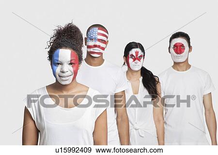 Portrait of Multi-ethnic group of friends with various national flags painted on their faces standing against white background View Large Photo Image Stock Photo - Portrait of Multi-ethnic group of friends with various national flags painted on their faces standing against white background. Fotosearch