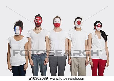Portrait of Multi-ethnic group of friends with various national flags painted on their faces standing at attention against white background View Large Photo Image Stock Photo - Portrait of Multi-ethnic group of friends with various national flags painted on their faces standing at attention against white background. Fotosearch