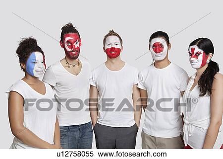 Portrait of Multi-ethnic group of friends with various national flags painted on their faces standing against white background View Large Photo Image Stock Photography - Portrait of Multi-ethnic group of friends with various national flags painted on their faces standing against white background. Fotosearch