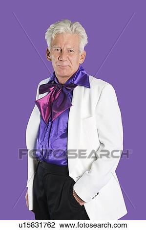 Portrait of senior man wearing old-fashioned suit against purple background View Large Photo Image Stock Image - Portrait of senior man wearing old-fashioned suit against purple background. Fotosearch