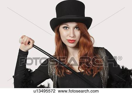 Portrait of woman old fashioned magician costume looking away against gray background View Large Photo Image Stock Image - Portrait of woman old fashioned magician costume looking away against gray background. Fotosearch
