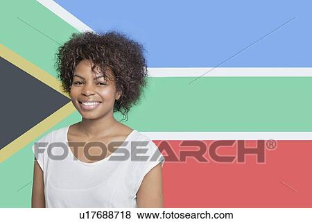 Portrait of young African American woman in white t-shirt smiling against South African flag View Large Photo Image Stock Photo - Portrait of young African American woman in white t-shirt smiling against South African flag. Fotosearch