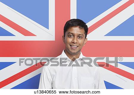 Portrait of young Asian man in shirt smiling against British flag View Large Photo Image Stock Photography - Portrait of young Asian man in shirt smiling against British flag. Fotosearch