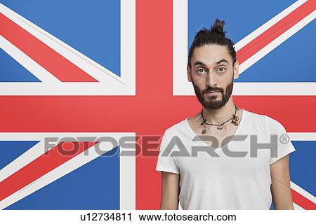Portrait of young Asian man in white t-shirt against British flag View Large Photo Image Stock Image - Portrait of young Asian man in white t-shirt against British flag. Fotosearch