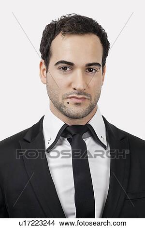 Portrait of young Caucasian businessman against white background View Large Photo Image Picture - Portrait of young Caucasian businessman against white background. Fotosearch