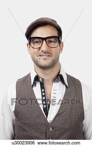 Portrait of young Caucasian man in flat cap against white background View Large Photo Image Stock Photograph - Portrait of young Caucasian man in flat cap against white background. Fotosearch