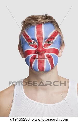 Portrait of young Caucasian man with British flag painted on face against white background View Large Photo Image Stock Photograph - Portrait of young Caucasian man with British flag painted on face against white background. Fotosearch