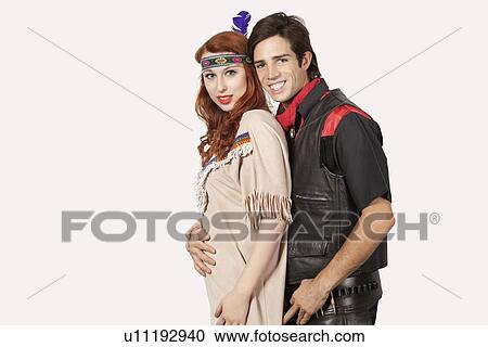 Portrait of young couple in old-fashioned costumes smiling against gray background View Large Photo Image Stock Image - Portrait of young couple in old-fashioned costumes smiling against gray background. Fotosearch