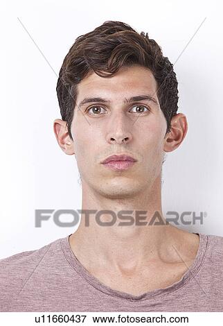 Stock Photo - Portrait of young man against white background. Fotosearch