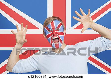 Portrait of young man with face painting screaming against British flag View Large Photo Image Stock Image - Portrait of young man with face painting screaming against British flag. Fotosearch