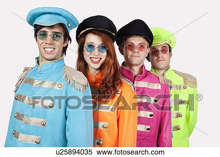 Portrait of young marching band members in colorful clothing against gray background View Large Photo Image Stock Photography - Portrait of young marching band members in colorful clothing against gray background. Fotosearch