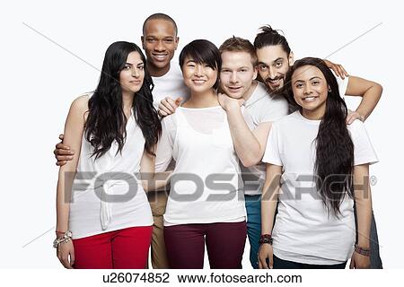 Portrait of young multi-ethnic friends in casuals smiling over white background View Large Photo Image Stock Image - Portrait of young multi-ethnic friends in casuals smiling over white background. Fotosearch