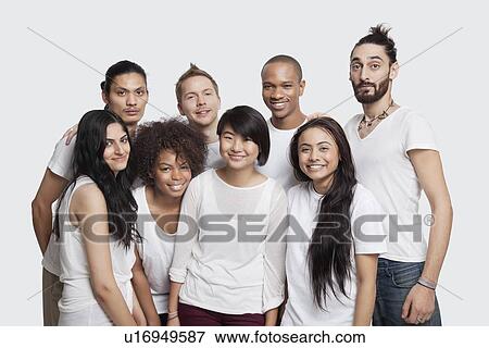 Portrait of young multi-ethnic friends smiling together against white background View Large Photo Image Stock Photo - Portrait of young multi-ethnic friends smiling together against white background. Fotosearch