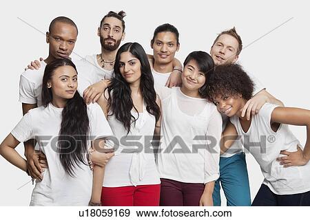 Portrait of young multi-ethnic friends posing against white background View Large Photo Image Stock Photo - Portrait of young multi-ethnic friends posing against white background. Fotosearch